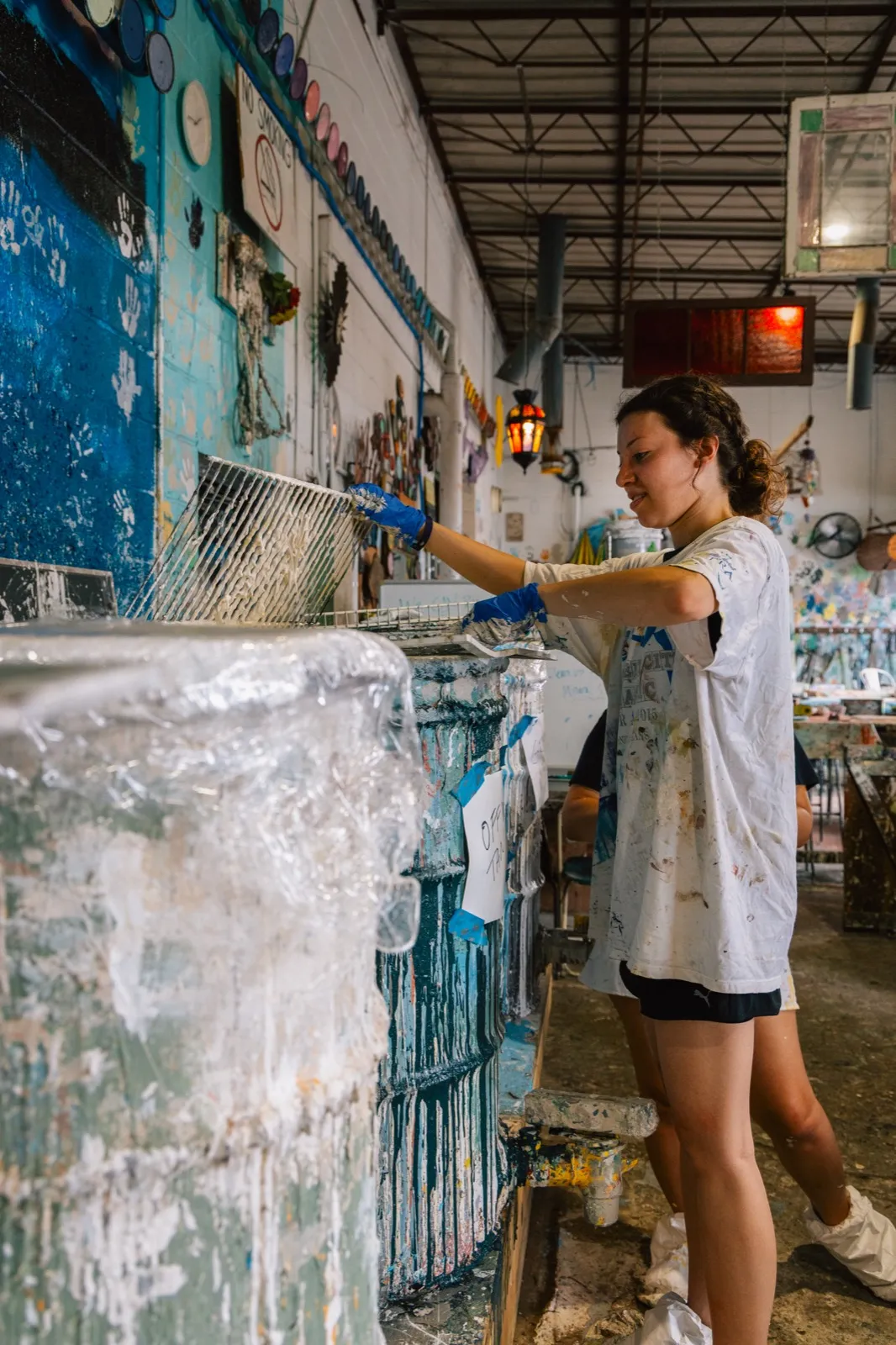 Student painting a mural