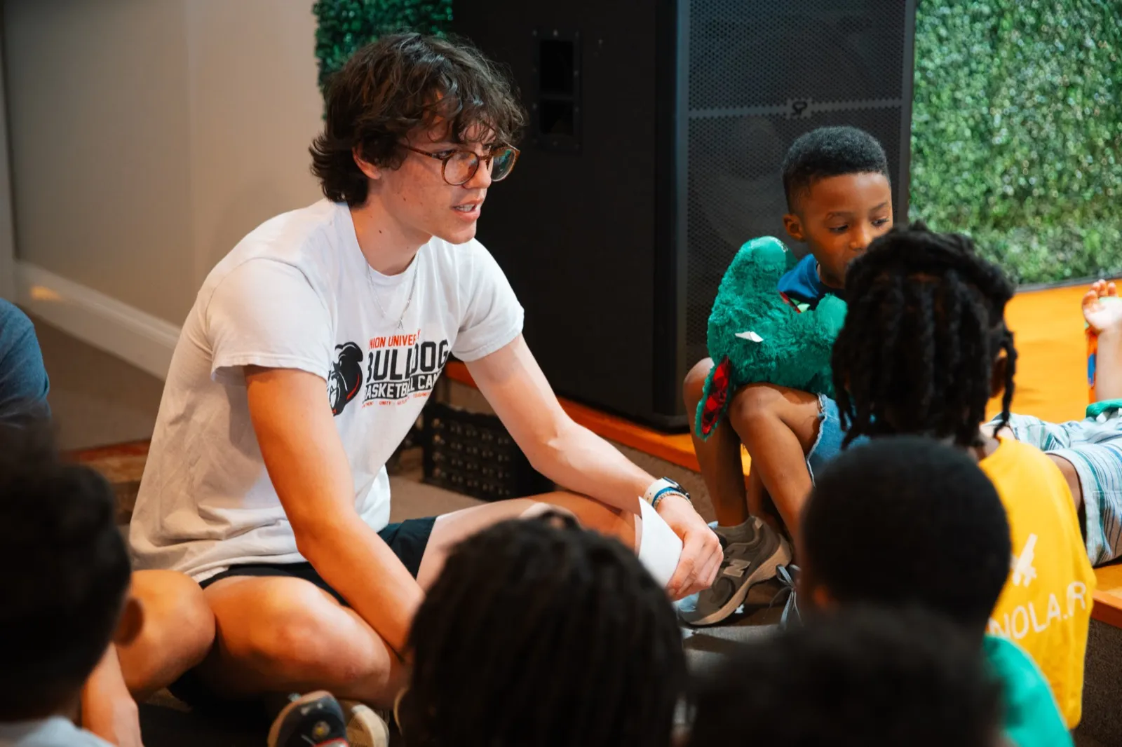 Volunteer talking with kids